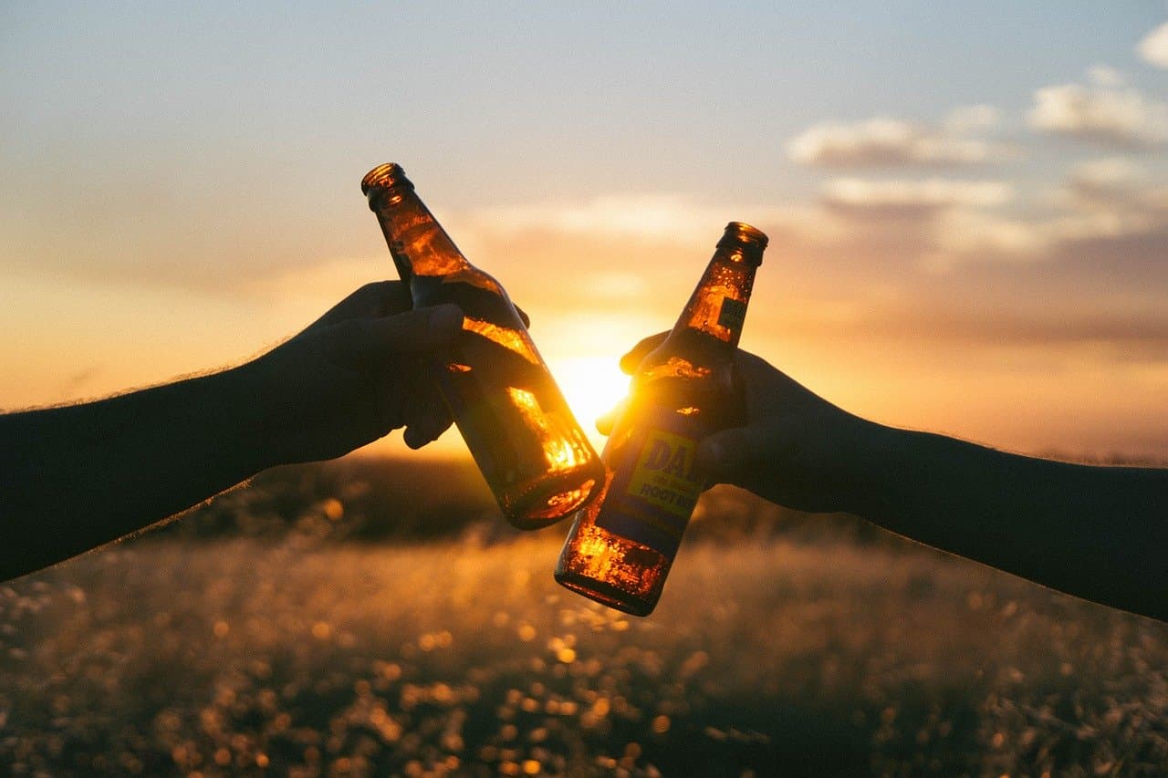 Friends raising glasses together